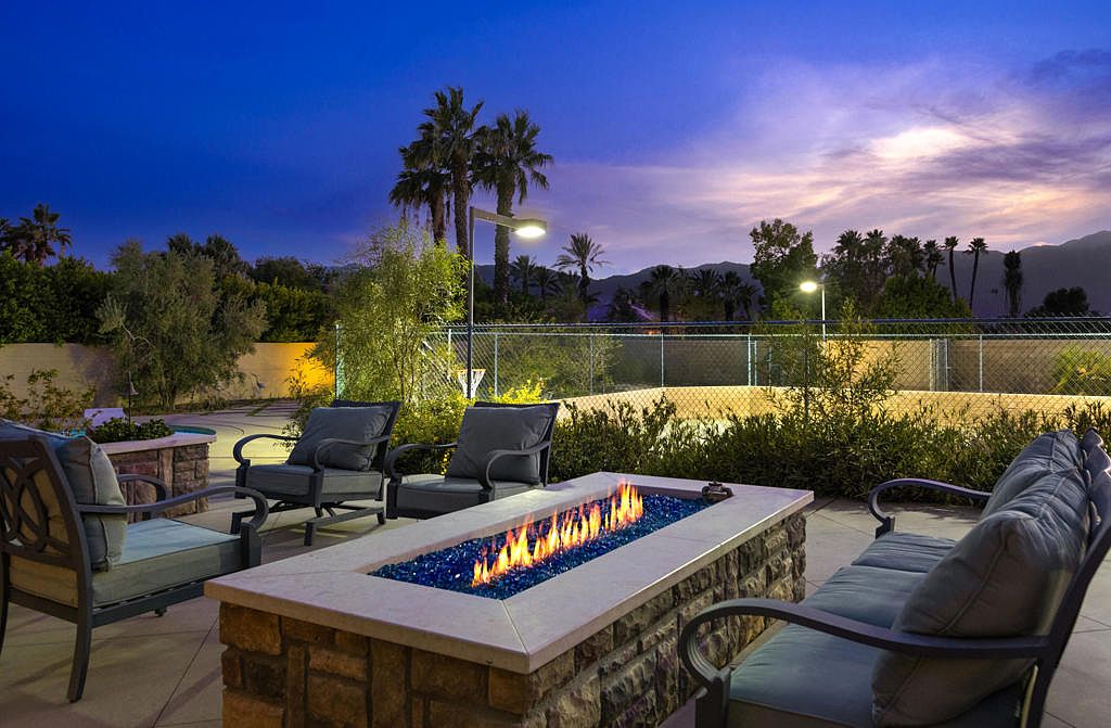 The outdoor fire pit at twilight, with the Santa Rosa Mountains in the distance turning pink